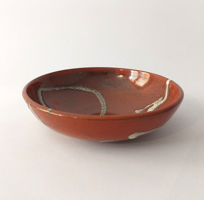 Shallow terracotta bowl