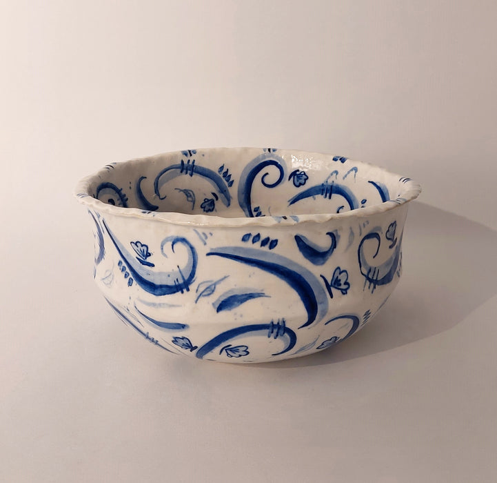 Ceramic bowl with blue decorations