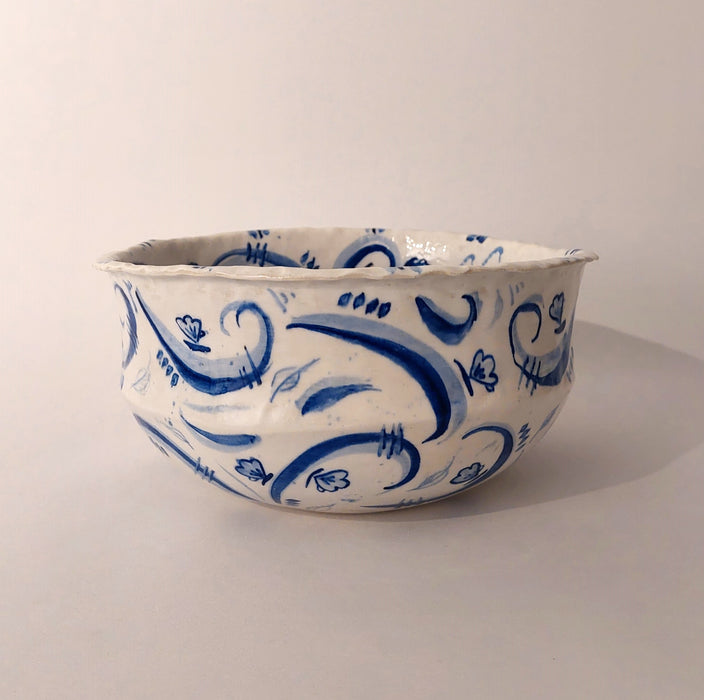 Ceramic bowl with blue decorations