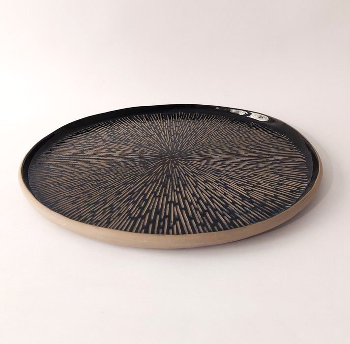 Ceramic platters with incisions