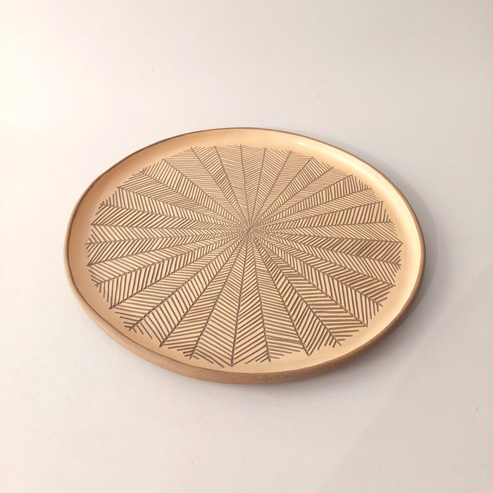 Ceramic platters with incisions