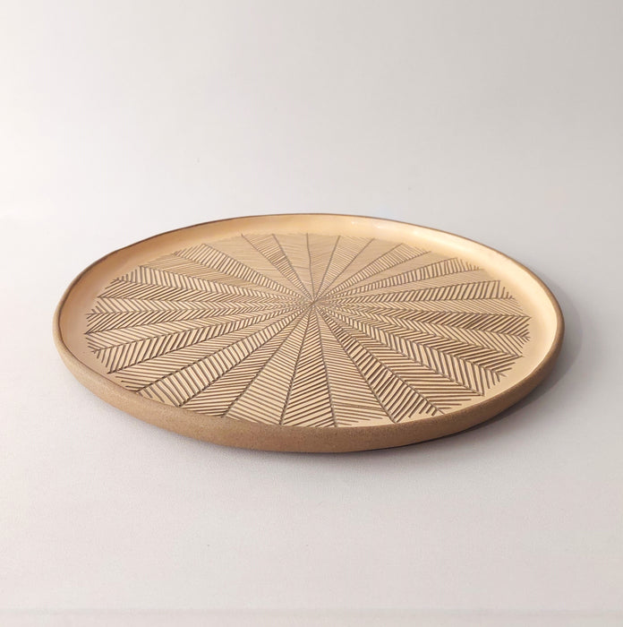 Ceramic platters with incisions