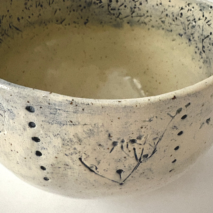 Medium sized bowl with blue imprints