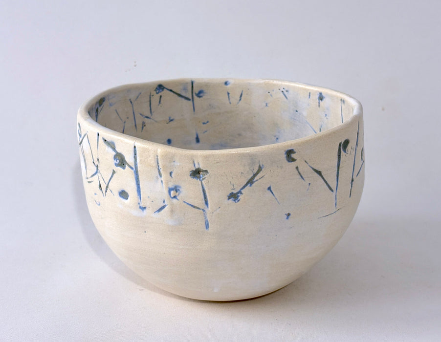 Medium sized bowl with blue imprints