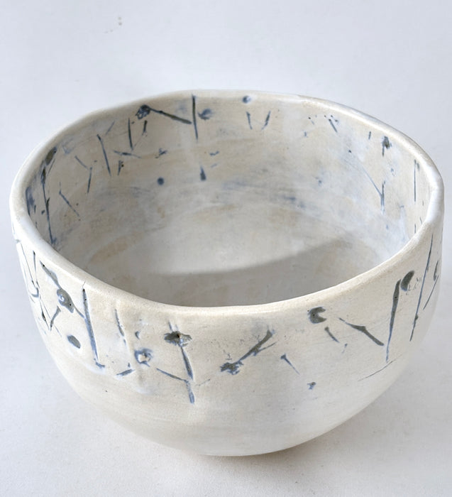 Medium sized bowl with blue imprints