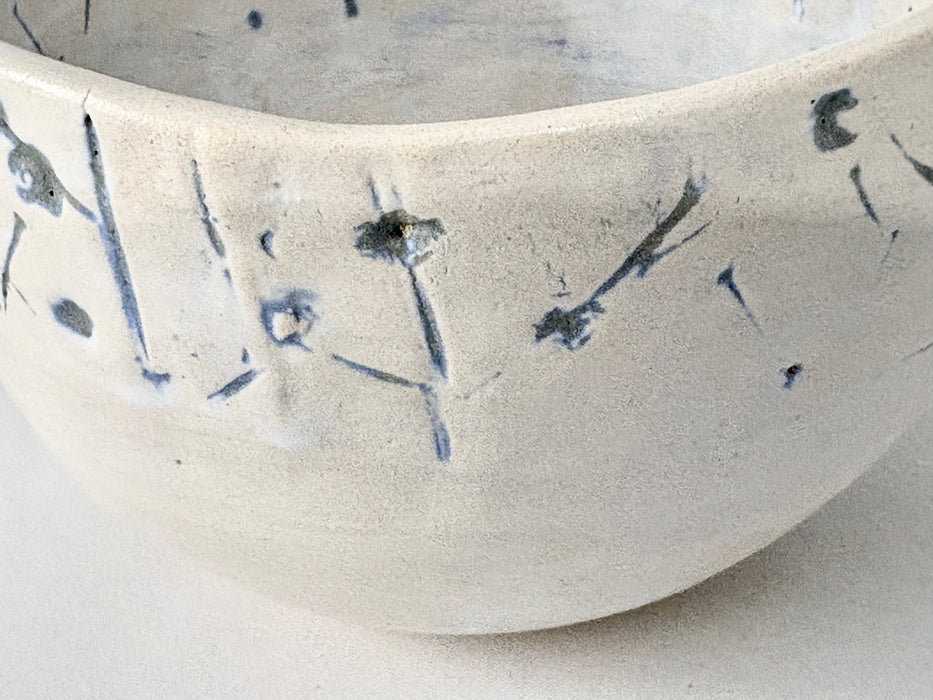 Medium sized bowl with blue imprints