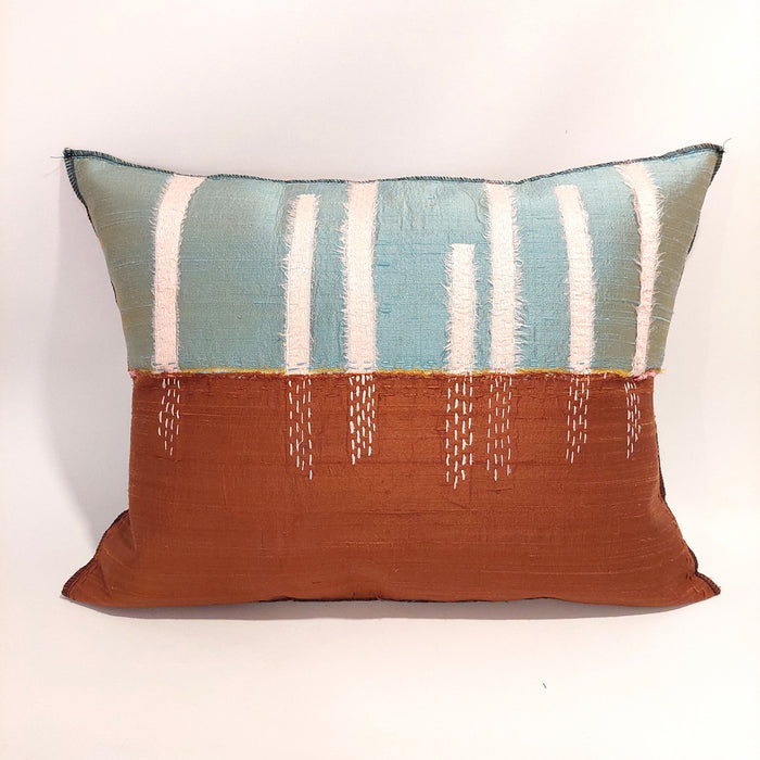 Silk cushion in aqua and terracotta