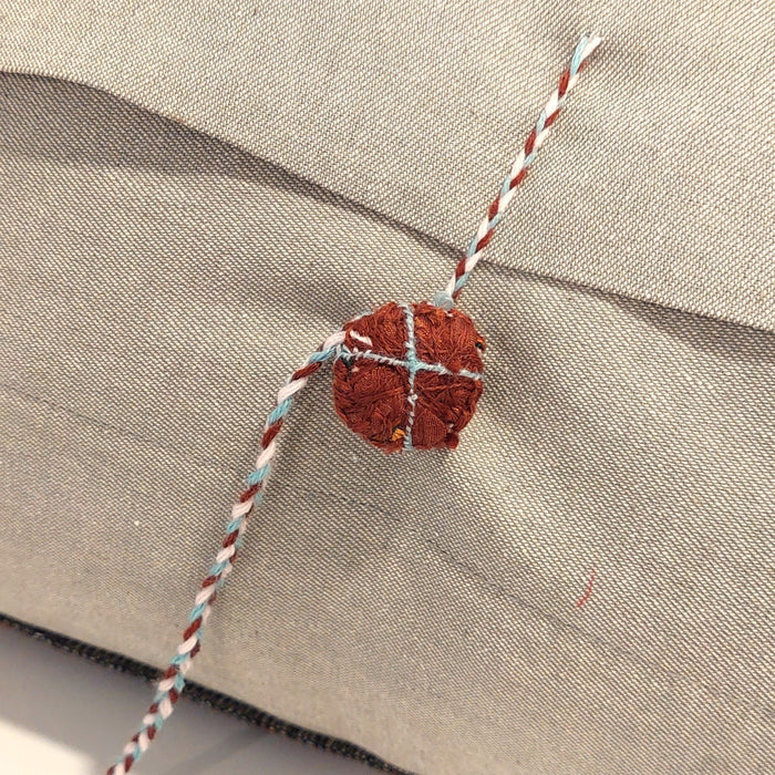 Silk cushion in aqua and terracotta
