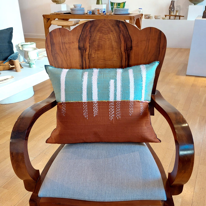 Silk cushion in aqua and terracotta