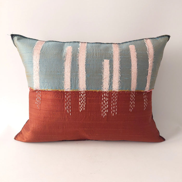Silk cushion in aqua and terracotta
