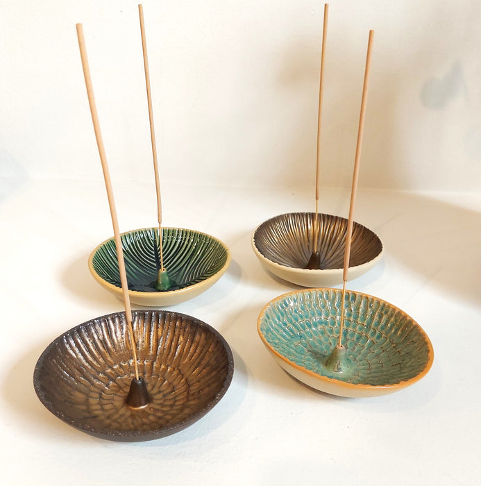 Ceramic incense holders in teal shades