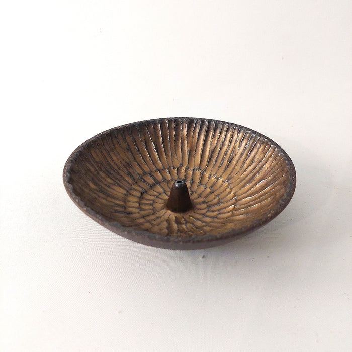 Ceramic incense holders in bronze shades