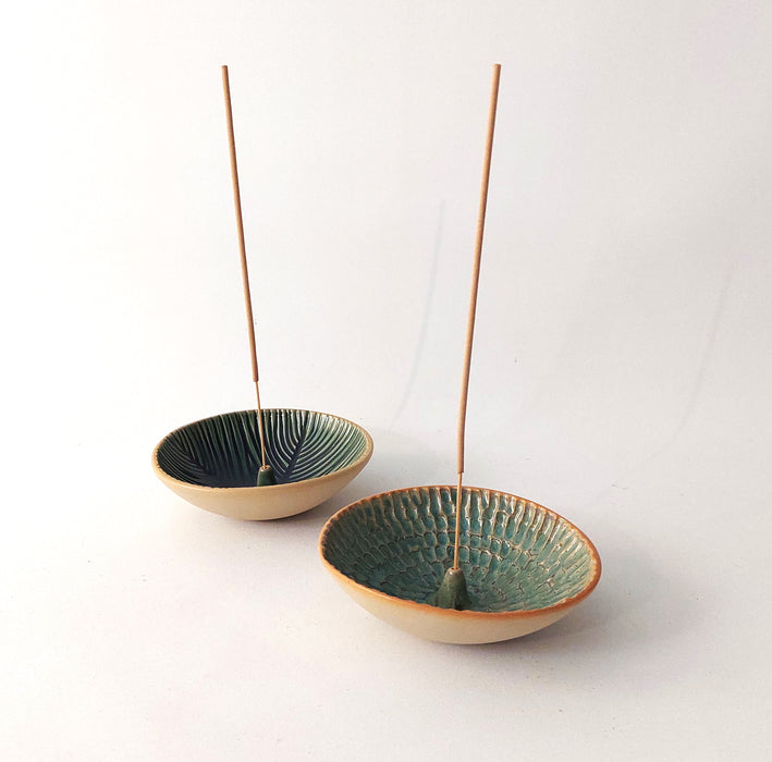 Ceramic incense holders in teal shades