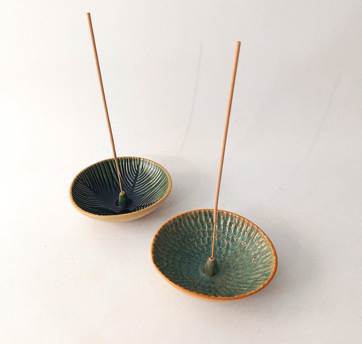 Ceramic incense holders in teal shades