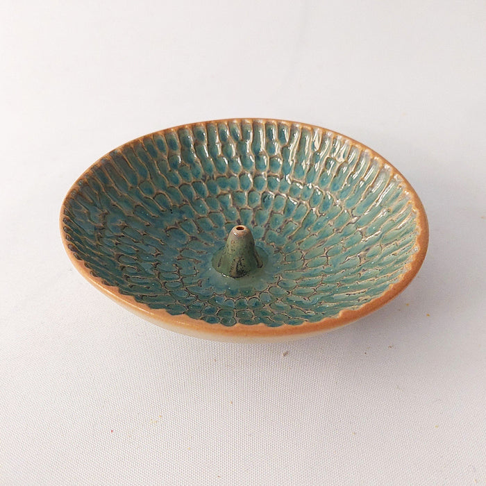 Ceramic incense holders in teal shades