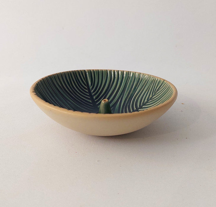 Ceramic incense holders in teal shades