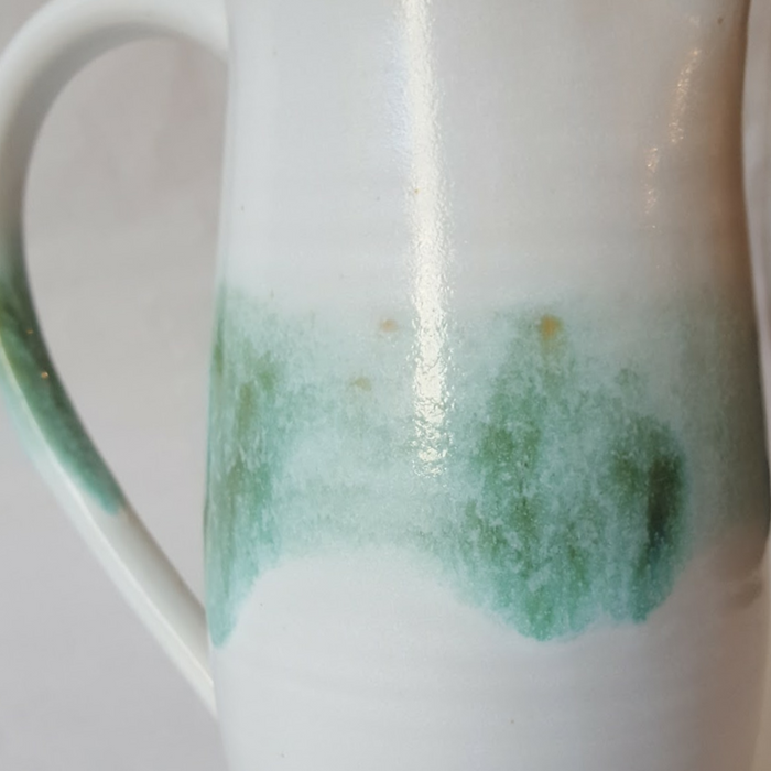 White jug with green brushstrokes