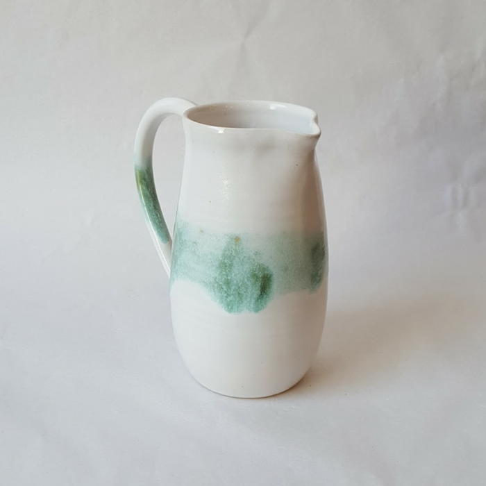 White jug with green brushstrokes